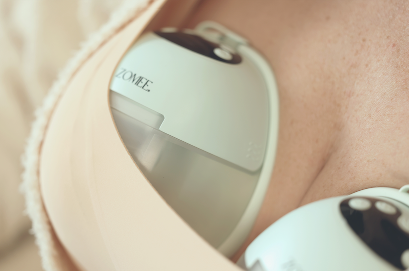 close-up of a woman wearing breast pumps with gentle vibration