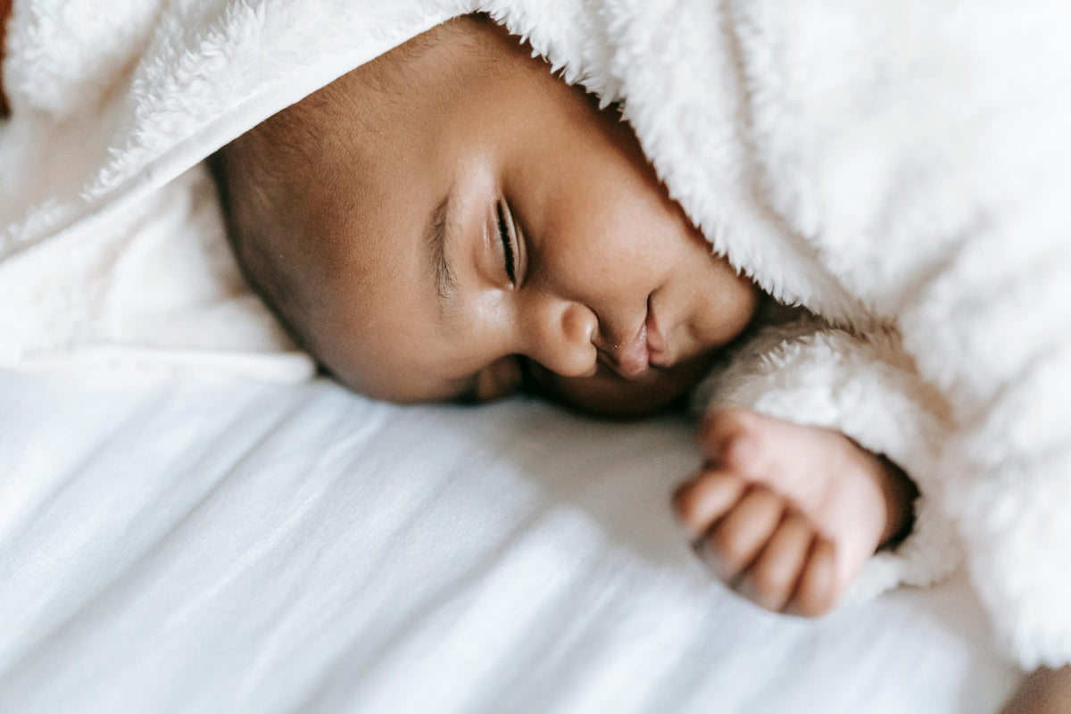 baby sleeping in cozy sheets