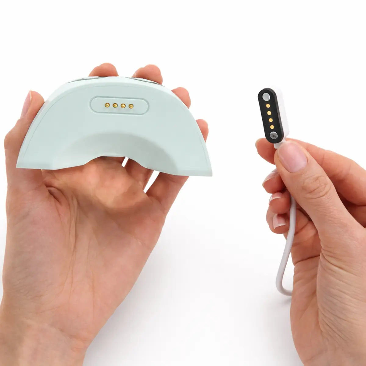 close up of the magnetic charging cable and the zomee mother's nature w1 breast pump