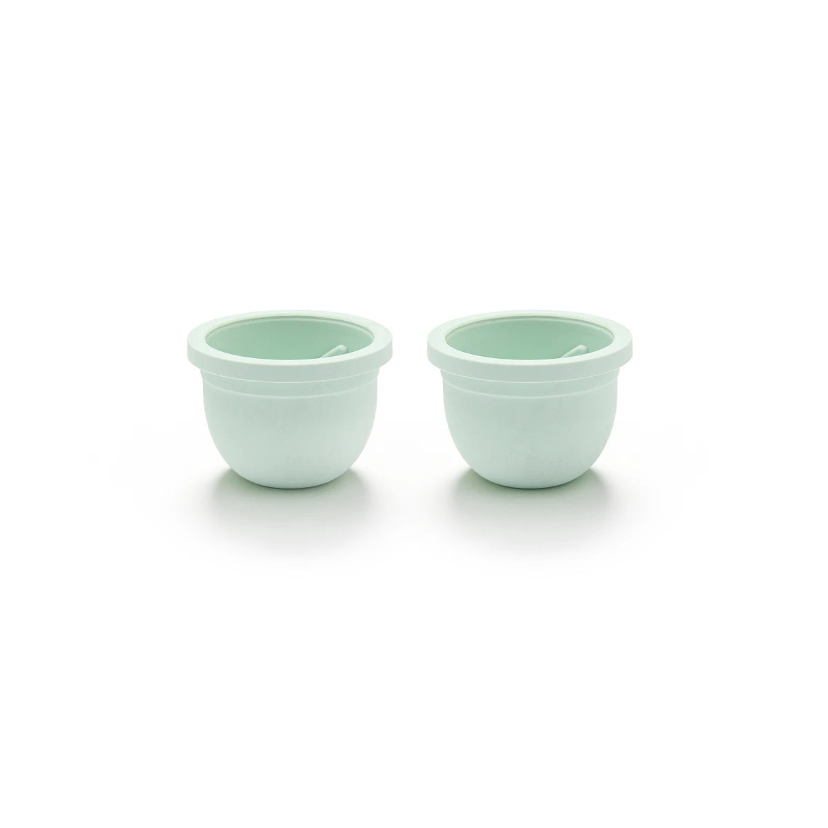 Two of the Mother’s Nature H1 Breast Pump Diaphragms in light green