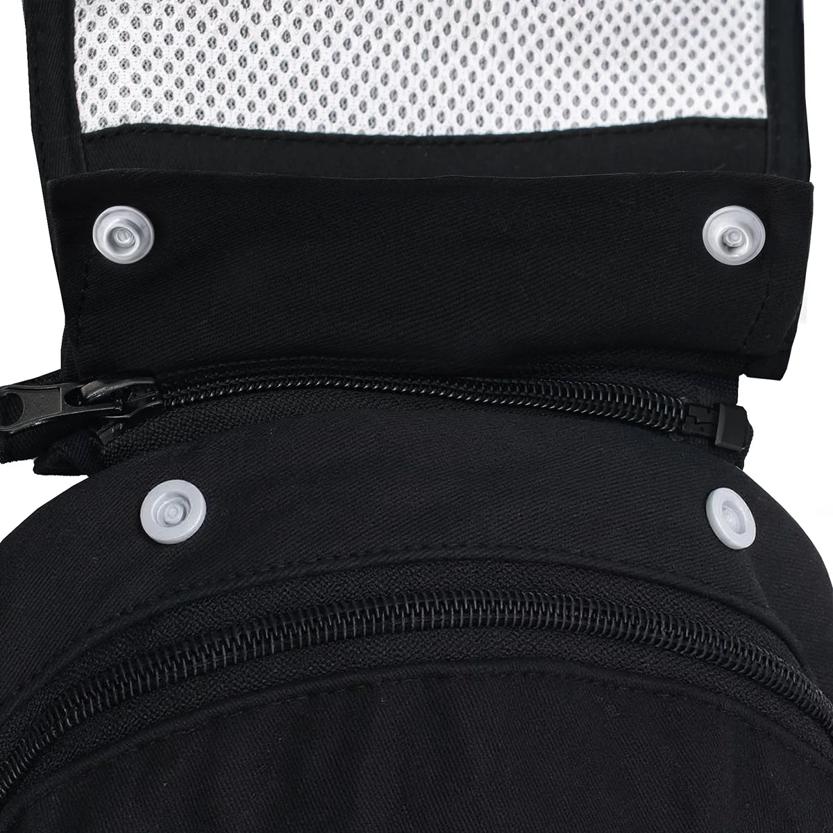 up close view of the zippers and snap buttons on the baby carrier