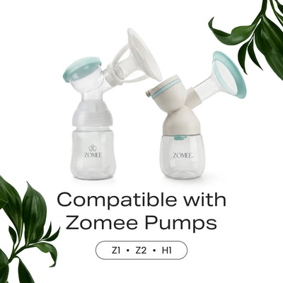 Two different Zomee bottles with different breast shield and flanges attached to show compatibility with all zomee tabletop breast pumps 