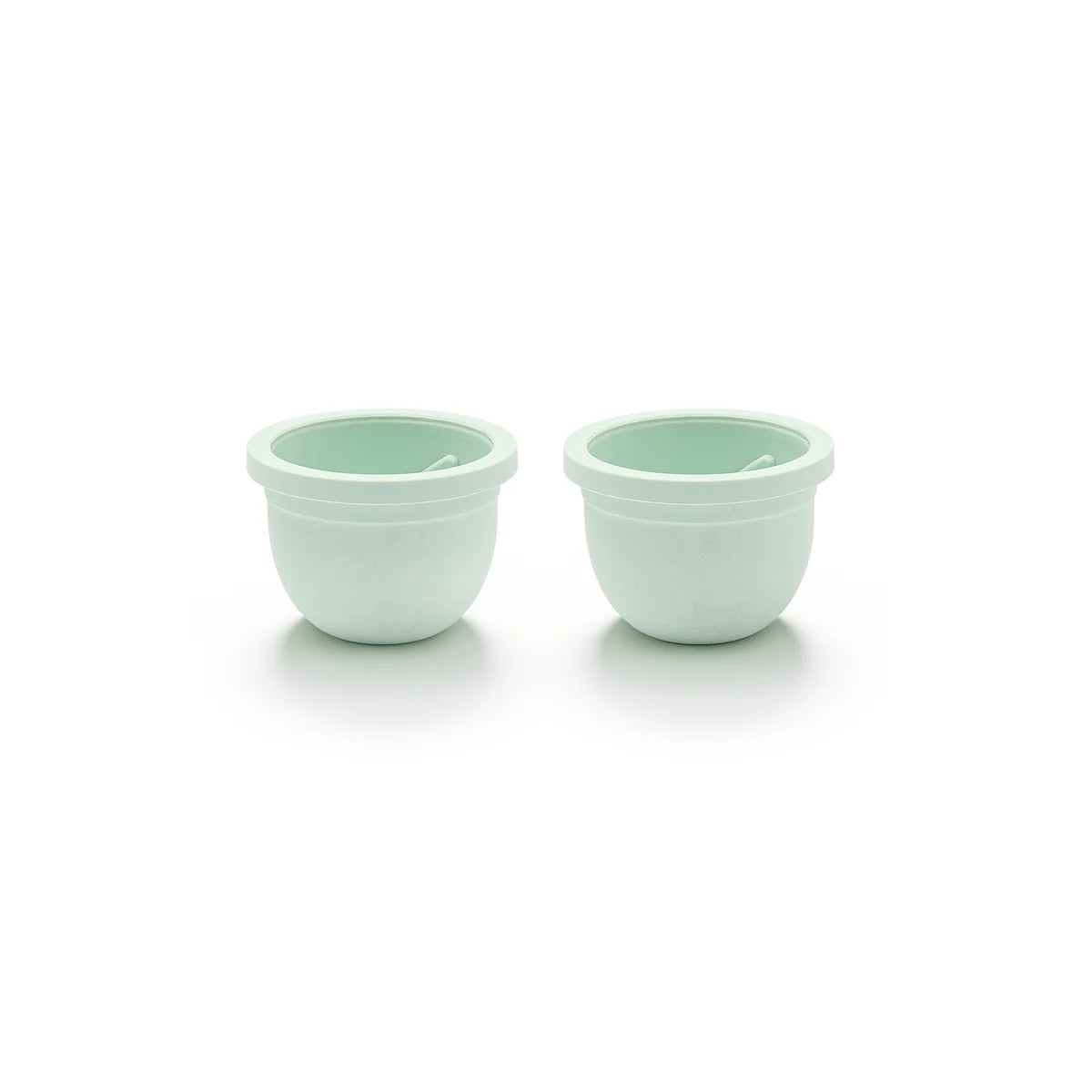 Two of the Mother’s Nature H1 Breast Pump Diaphragms in light green
