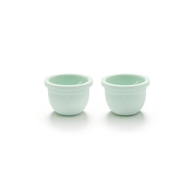 Two of the Mother’s Nature H1 Breast Pump Diaphragms in light green