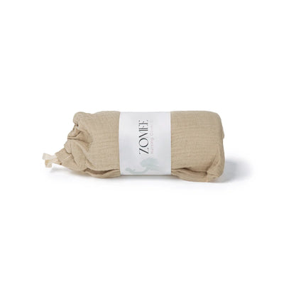 wrapped up beige muslin nursing cover with Zomee packaging