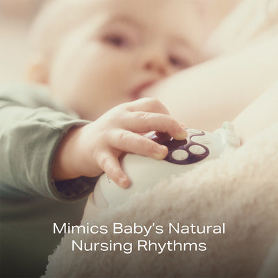 mom wearing the Zomee Mother's Nature breast pump on one breast while nursing her baby on the other to replicate the baby's natural nursing rhythms.